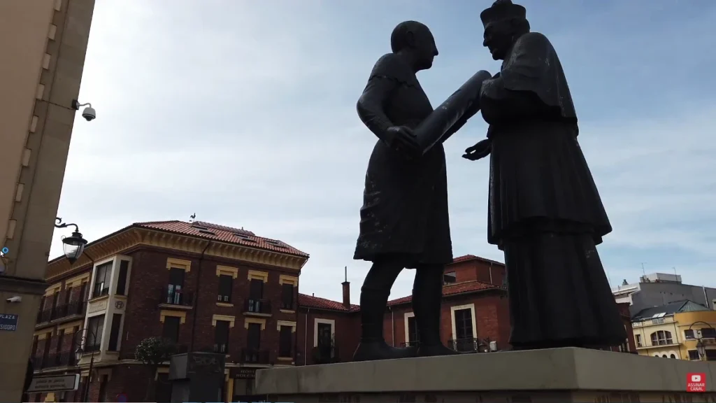 Escultura de dois personagens se cumprimentando, em León, Espanha.