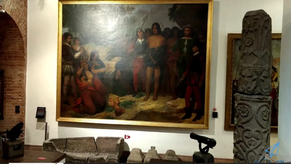 Uma grande pintura histórica retratando um encontro entre exploradores e povos indígenas.