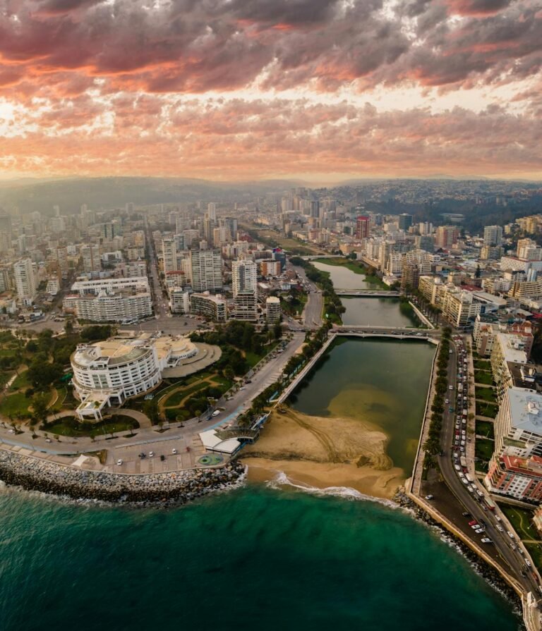 city with river on sea coast in chile at sunset