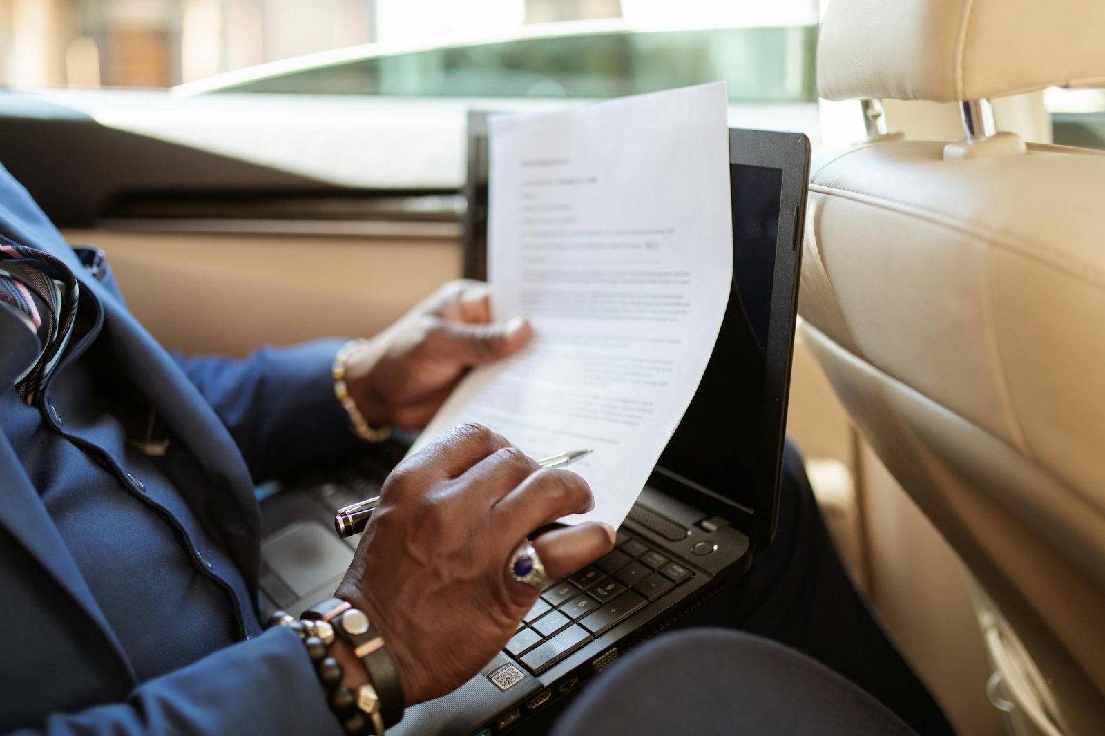 person in blue long sleeve shirt using black laptop computer