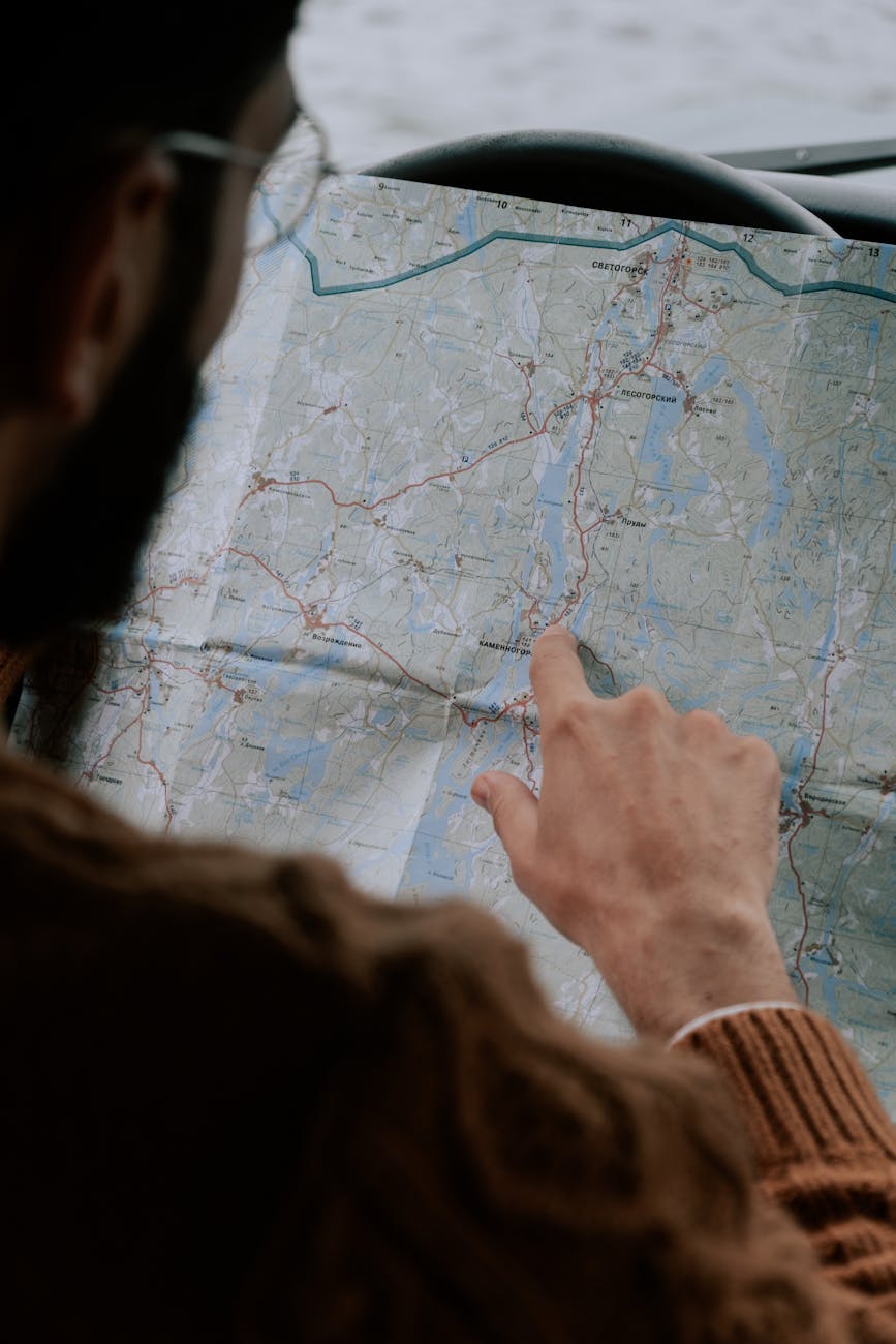 a man looking at a map