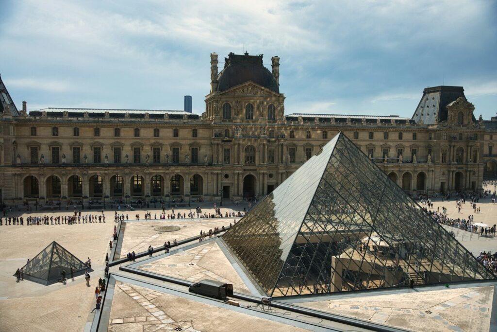 The louvre museum with its famous glass pyramid.