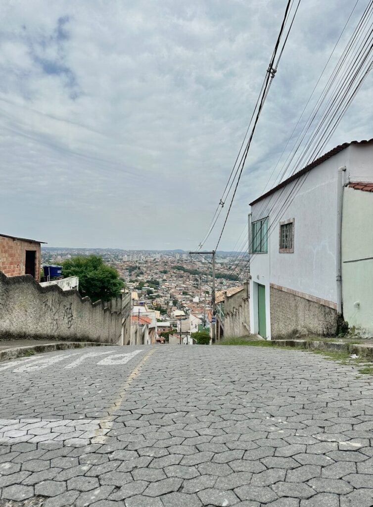 a stone road with buildings on either side of it