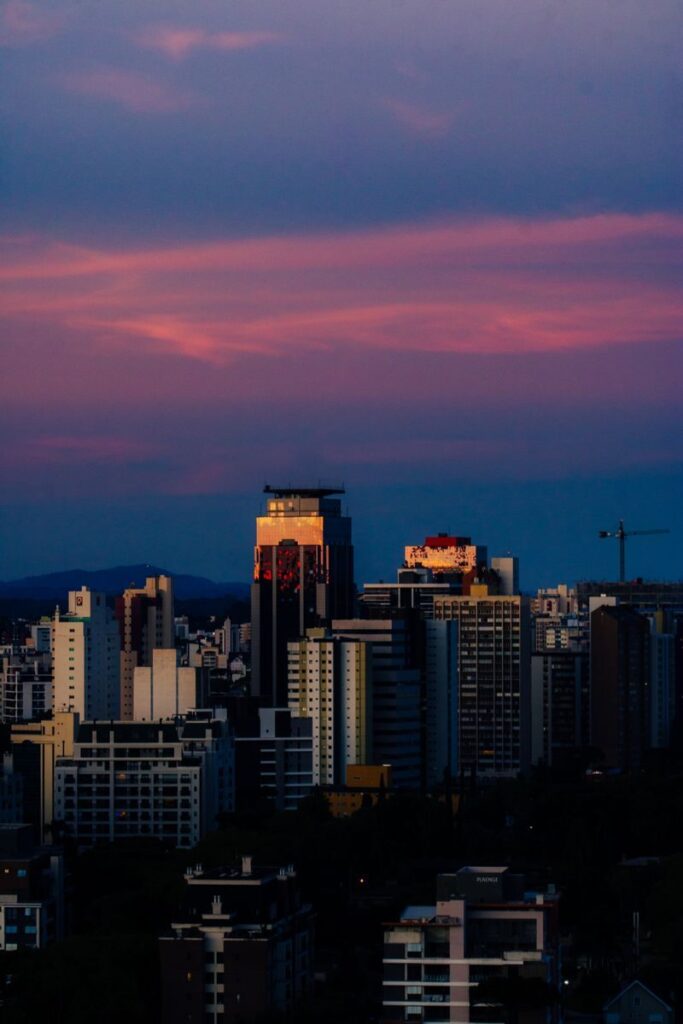Urban skyline illuminated by stunning twilight colors, showcasing modern architecture.