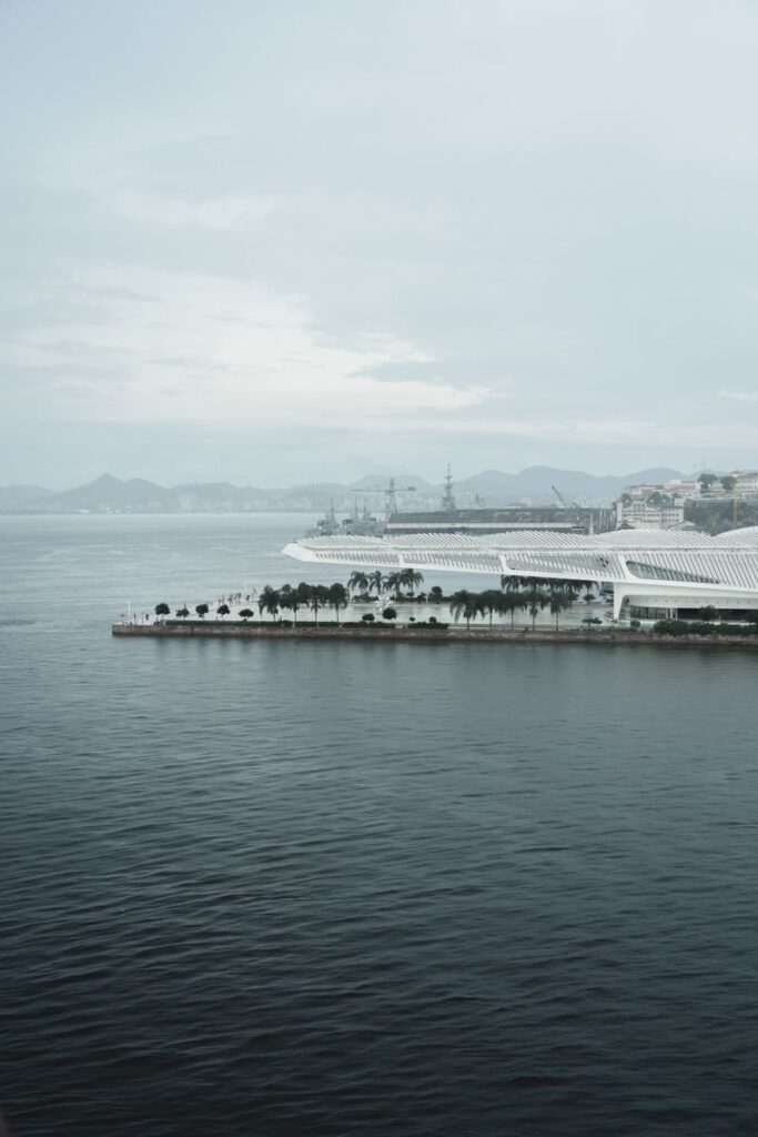 A serene aerial view over the Museu do Amanhã and coastline in Rio de Janeiro, Brazil.